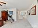 Upstairs hallway with carpet flooring and artwork leading to various rooms at 3207 Oliver Stanley Trl, Lancaster, SC 29720