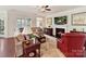 Cozy living room with a ceiling fan, fireplace, comfortable seating, and natural light at 3207 Oliver Stanley Trl, Lancaster, SC 29720