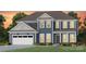 Two-story home with gray siding, white trim, and a three-car garage at 3539 Rapport Ct # 022, Lancaster, SC 29720