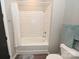 Bathroom with a bathtub and shower, and white tile at 3630 N Davidson St, Charlotte, NC 28205