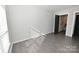 Bright bedroom with hardwood floors and access to a bathroom at 3630 N Davidson St, Charlotte, NC 28205