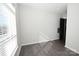 Spacious bedroom with hardwood floors and large window at 3630 N Davidson St, Charlotte, NC 28205