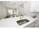 Modern kitchen with island, stainless steel appliances, and white cabinets at 3630 N Davidson St, Charlotte, NC 28205