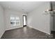 Bright living room with large windows and hardwood floors at 3630 N Davidson St, Charlotte, NC 28205