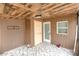 Covered back porch with wood-paneled walls and tile floor at 412 N Vance St, Gastonia, NC 28052