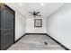 Bedroom with gray floors, white walls, and ceiling fan at 412 N Vance St, Gastonia, NC 28052