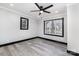 Bright bedroom with ceiling fan, hardwood floors, and a large window at 412 N Vance St, Gastonia, NC 28052