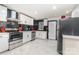 Modern kitchen with stainless steel appliances and white cabinets at 412 N Vance St, Gastonia, NC 28052