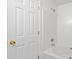 Bathroom featuring white tiled shower/tub and a door to the exterior of the home at 4321 Bobterry Ct, Charlotte, NC 28216