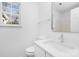 Simple bathroom with white vanity and a modern rectangular mirror at 4321 Bobterry Ct, Charlotte, NC 28216