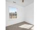 Well-lit bedroom featuring a large window and neutral carpet at 4321 Bobterry Ct, Charlotte, NC 28216