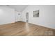 Living room with hardwood floors and a view of the kitchen at 4321 Bobterry Ct, Charlotte, NC 28216