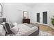 Relaxing bedroom featuring neutral tones, natural light, and access to the outdoors at 4321 Bobterry Ct, Charlotte, NC 28216