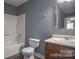 Clean bathroom, featuring a tub, toilet, and vanity with a mirror at 4335 Saluda Rd, Rock Hill, SC 29730