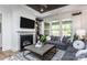 Spacious living room with gray sectional sofa, fireplace, and built-in shelving at 4784 Formation Ct # 066, Lancaster, SC 29720