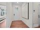 Bright entryway with hardwood floors, white door, and large wall art at 4803 Formation Ct # 104, Lancaster, SC 29720