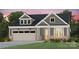 Craftsman style home with gray siding, brick accents, and a two-car garage at 4803 Formation Ct # 104, Lancaster, SC 29720