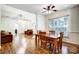 Inviting dining area with hardwood floors, ceiling fan, and lots of natural light at 4918 Sunset Ridge Ct, Charlotte, NC 28269