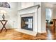 Elegant fireplace with white mantel, marble surround, and hardwood floors at 4918 Sunset Ridge Ct, Charlotte, NC 28269