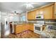 An eat-in kitchen with granite countertops and wooden cabinets at 4918 Sunset Ridge Ct, Charlotte, NC 28269