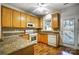 A cozy kitchen with stainless steel appliances and oak cabinets at 4918 Sunset Ridge Ct, Charlotte, NC 28269