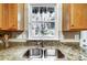 A kitchen sink with stainless steel basin and updated hardware at 4918 Sunset Ridge Ct, Charlotte, NC 28269