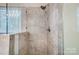 A walk-in shower featuring glass and tile at 4918 Sunset Ridge Ct, Charlotte, NC 28269