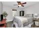 Bedroom with a ceiling fan, a window and hardwood floors at 4923 Park Rd # D, Charlotte, NC 28209