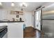 Bright kitchen with stainless steel refrigerator and view of the door to the backyard at 4923 Park Rd # D, Charlotte, NC 28209