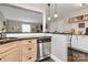 Inviting kitchen featuring stainless steel appliances, a breakfast bar, and seamless flow into the adjacent living area at 4923 Park Rd # D, Charlotte, NC 28209