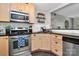 Efficient kitchen design featuring stainless steel appliances and ample counter space at 4923 Park Rd # D, Charlotte, NC 28209