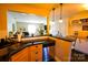 Modern kitchen with breakfast bar and view to living room at 4923 Park Rd # D, Charlotte, NC 28209