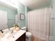 Clean bathroom with updated vanity and shower at 4968 Sunburst Ln, Charlotte, NC 28213