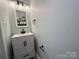 Small bathroom with a white vanity and modern fixtures at 4968 Sunburst Ln, Charlotte, NC 28213