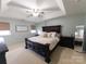 Main bedroom with a king-size bed and decorative wall art at 4968 Sunburst Ln, Charlotte, NC 28213