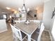 Bright dining room with a table set for six and access to kitchen at 4968 Sunburst Ln, Charlotte, NC 28213