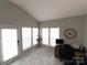 Sunroom with marble flooring, plenty of windows, and a workspace at 4968 Sunburst Ln, Charlotte, NC 28213