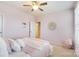 Charming bedroom with pink walls, plush bedding, and ample natural light at 501 Alucio Ct, Matthews, NC 28104