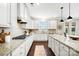 Gourmet kitchen featuring granite countertops, stainless appliances, custom cabinetry, and a center island at 501 Alucio Ct, Matthews, NC 28104