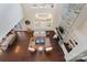 Bright living room with high ceilings, a stone fireplace, and hardwood floors at 501 Alucio Ct, Matthews, NC 28104