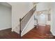 Impressive staircase with wrought iron railing and hardwood floors at 501 Alucio Ct, Matthews, NC 28104