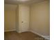 Spacious bedroom with neutral walls, carpet, and closet at 518 Oak St, Troy, NC 27371