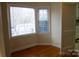 Bright dining area with bay window and view into kitchen at 518 Oak St, Troy, NC 27371