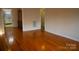 Hardwood floor dining room with built-in hutch and kitchen view at 518 Oak St, Troy, NC 27371