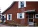 Brick house exterior with white shutters and a covered entryway at 518 Oak St, Troy, NC 27371