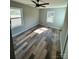 Bright bedroom featuring wood floors, neutral walls, and natural light from two windows at 552 6Th St, Chester, SC 29706