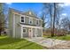 An attractive two-story house is displayed on a lush lawn with newly poured concrete at 5812 Torrence St, Charlotte, NC 28269