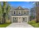 Charming two-story home featuring a welcoming front porch and a freshly poured concrete driveway at 5812 Torrence St, Charlotte, NC 28269