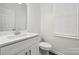 Clean bathroom with white vanity, quartz countertop, and modern fixtures at 6518 Afterglow Dr, Indian Trail, NC 28079