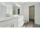 Modern bathroom with double vanity and a large mirror at 6518 Afterglow Dr, Indian Trail, NC 28079